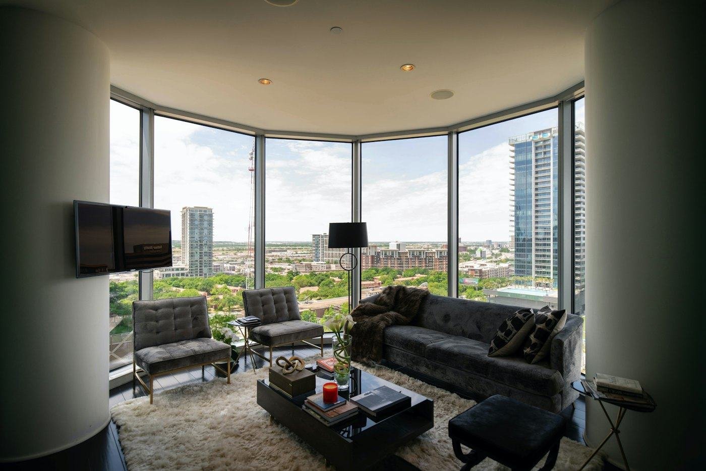Living room with wall-to-wall carpet and city view