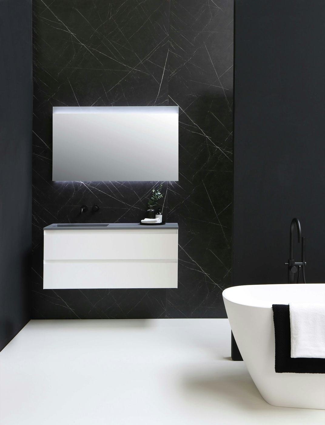 Modern bathroom with floating vanity and freestanding tub