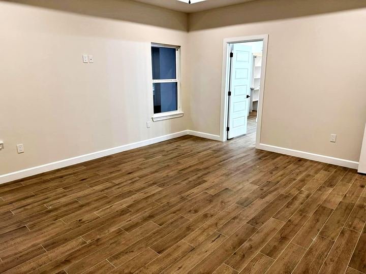 Wood-look porcelain tile floor installed by Elyon Floors