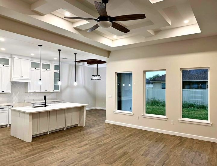 Kitchen remodel with white shaker cabinets and quartz countertops