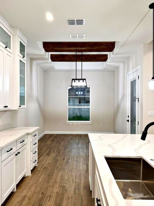 Kitchen remodel with white shaker cabinets and quartz countertops
