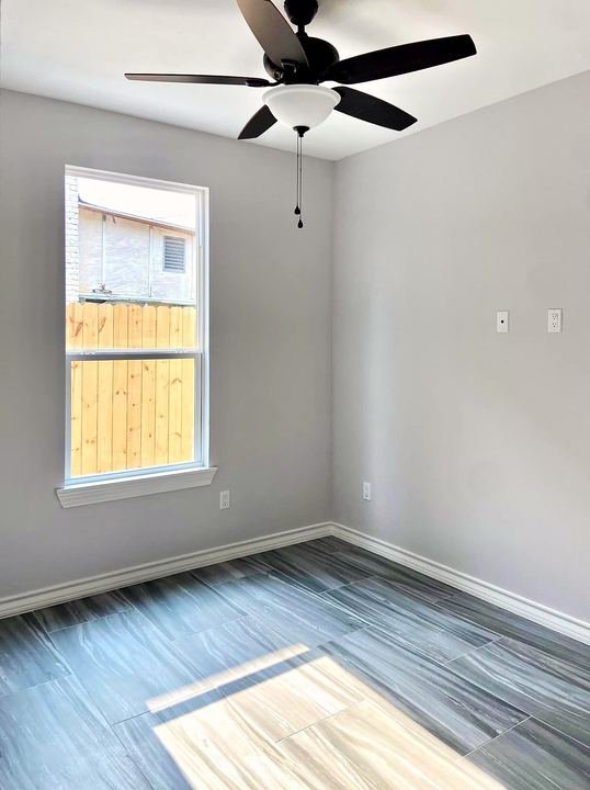 Wood-look porcelain tile floor installed by Elyon Floors