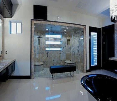 Remodeled bathroom with walk-in glass shower